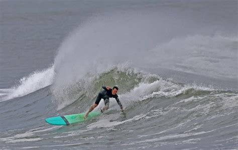 Hurricane Franklin fires off waves in Rhode Island, sending surfers flocking to the water